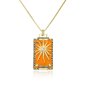 Macro view of Sun Tarot card pendant with 18K gold plating and colorful zircon stones