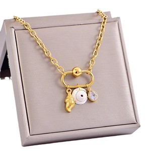 Gold stainless steel necklace with shell pendants and zircon on a gift box