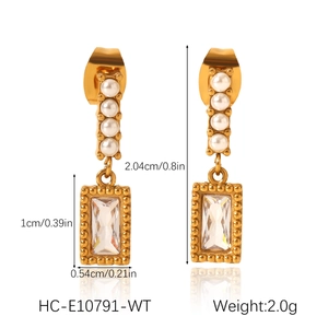 Macro detail of gold earrings with pearls and zircon crystals including measurements
