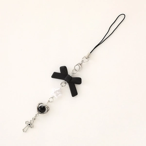 Handmade phone charm with black bow, silver cross pendant and heart-shaped frame