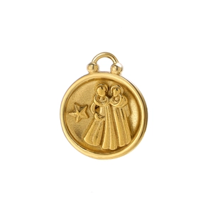 Macro detail of 18K gold-plated zodiac pendant featuring embossed Gemini twins design