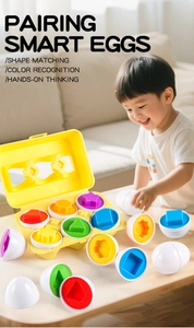 Detail showing toddler interacting with pairing smart eggs for shape and color recognition
