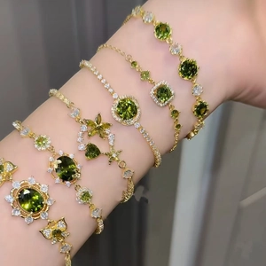 Elegant 18k gold plated bracelets with emerald green zircons and geometric floral charms