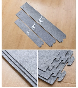 Detail of grey felt Christmas tree collar with reindeer cutouts and interlocking tabs