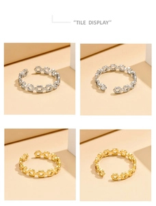 Detailed tile display of geometric hollow star rings in gold and silver finishes