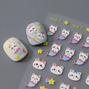 3D embossed nail stickers featuring cute white cartoon cats and mermaid fish motifs