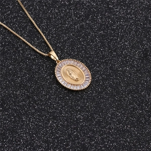 Detail of gold pendant featuring Virgin Mary relief with rectangular zirconia border