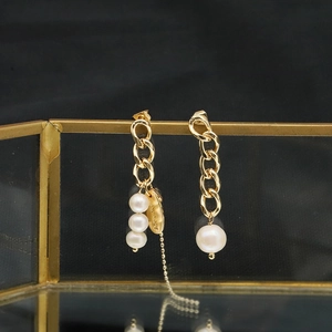 Asymmetric natural pearl tassel earrings with 18k gold plating and handmade charms