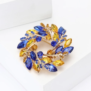 Elegant gold alloy wheat wreath brooch with blue and yellow marquise crystals