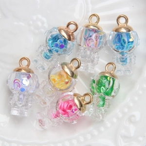 Transparent robot charms with colorful sequins in glass globes, seven pieces set