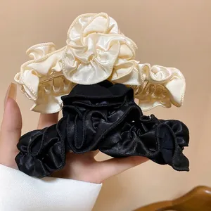 Elegant pleated fabric hair claw clips in black and beige for thick hair styling
