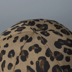 Close-up of leopard print bucket hat crown showing durable twill fabric and stitching