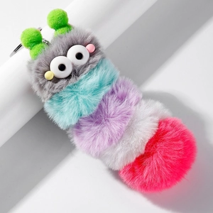 Colorful plush caterpillar keychain with soft pom-poms and cute cartoon eyes on white