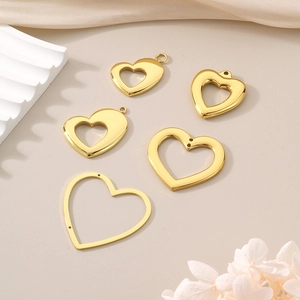 Polished gold heart-shaped hollow pendants in five styles on elegant silk background
