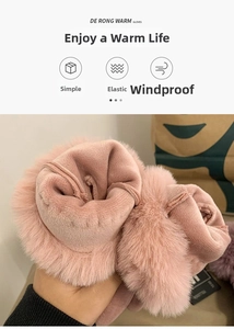 Detail of pink faux fur lining on suede gloves showing thick thermal insulation
