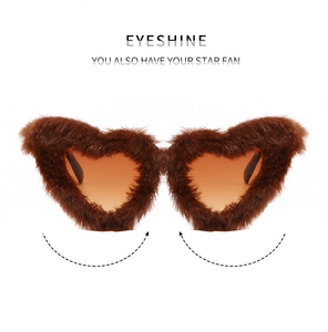 Detailed front view of heart-shaped sunglasses with brown faux fur trim and tinted lenses