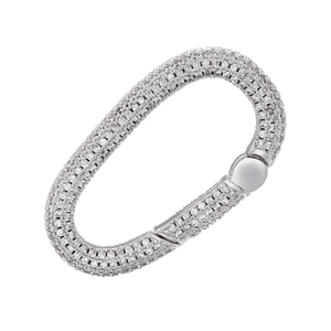 Macro view of silver-plated oval jewelry clasp with sparkling pavé crystals for DIY necklaces