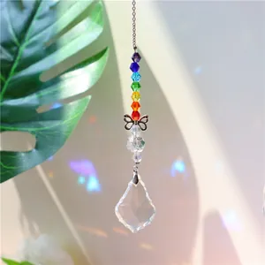 Detail of crystal suncatcher with rainbow beads, metal butterfly, and faceted prism
