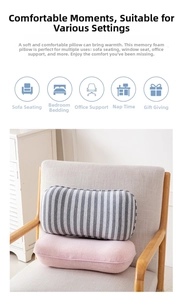 Ergonomic memory foam pillows on a chair showing soft grey stripes and pink textures