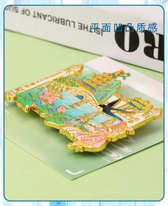 Detailed macro view of West Lake zinc alloy souvenir magnet with embossed floral texture