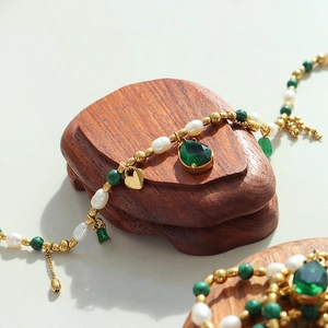 Gold pendant necklace with freshwater pearls, malachite beads and green teardrop gemstone