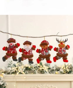 Set of four plush Christmas ornaments including Santa and snowman on wooden branches