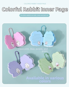 Detail of cute rabbit-shaped mini notebooks with colorful pages and bead chains