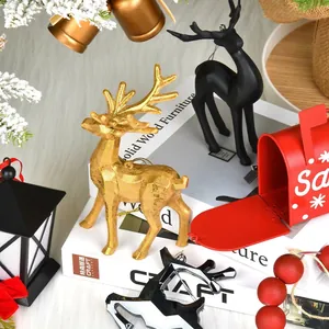 Festive gold reindeer ornaments with red metal mailbox and black street lamp decorations