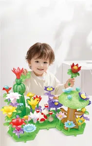 Close-up of children's hands assembling colorful DIY flower garden building blocks toy