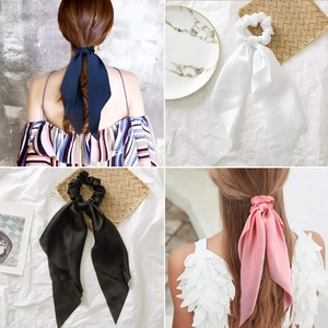 Detailed set of solid color satin scrunchies with long streamers in four elegant colors