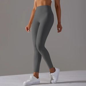 Detail of high-waist seamless yoga leggings in dark grey with matte finish texture