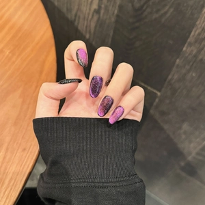 Elegant almond-shaped purple cat-eye press-on nails with silver glitter gradient effect