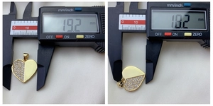 Detailed size measurement of a heart pendant featuring gold plating and cubic zirconia