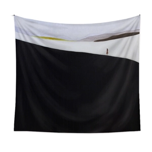 Minimalist landscape tapestry with a small figure on black hills and white sky