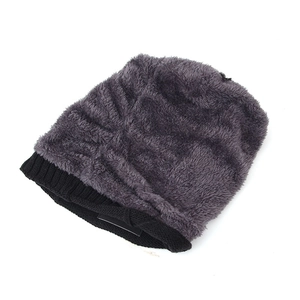 Detail of soft dark grey faux fur winter beanie with black ribbed knit trim for outdoor warmth