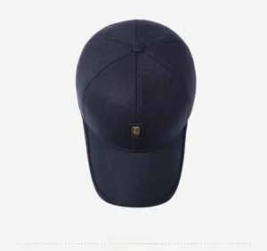 Top down view of a deep blue fleece-lined baseball cap with a textured logo patch