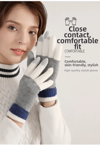 Close-up of winter knitted wool gloves featuring a blue and grey gradient stripe design