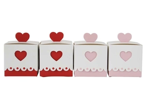 Detail of heart-shaped gift boxes with cutout design and 3D heart lids for wedding candy