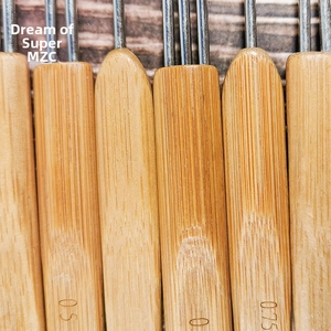 Detailed macro view of 0.5mm and 0.75mm bamboo handles for dreadlock crochet needle tools