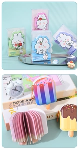 Detailed view of various cute cartoon squishy notebooks and popsicle shaped stationery set