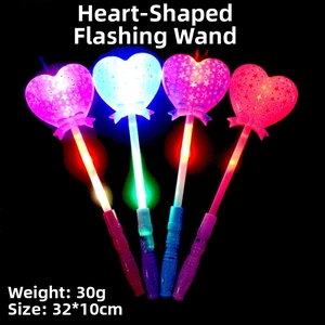 Macro detail of glowing heart-shaped LED magic wands with stars and bows in four colors