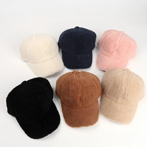 Detailed top view of various corduroy and lambswool baseball caps in six solid colors