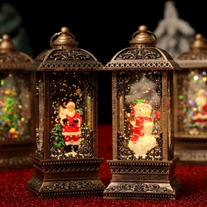 Detail of vintage bronze Christmas lantern with Santa and snowman inside glitter water