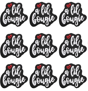 Detailed view of 9-piece embroidered patches set with a lil bougie text on white background