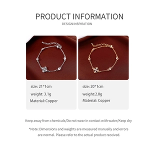 Detail of silver and gold plated bracelets with cubic zirconia clover charms and lobster clasp