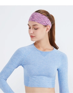 Close-up of purple elastic sweatband worn by a model for yoga and running sports