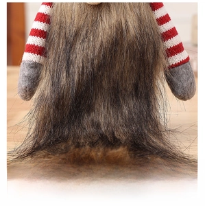 Detail of soft brown plush beard and striped knit texture on Christmas gnome wine cover