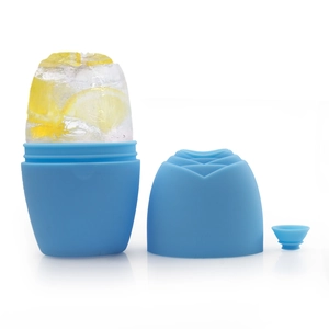 Detailed view of blue silicone facial ice roller showing rose pattern and lemon ice cube