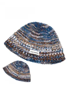 Detail view of colorful knit bucket hat with Love Fashion tag and mixed blue yarn texture