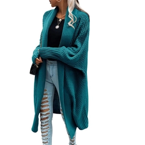 Detail view of deep teal knit cardigan featuring textured knit and casual batwing sleeves
